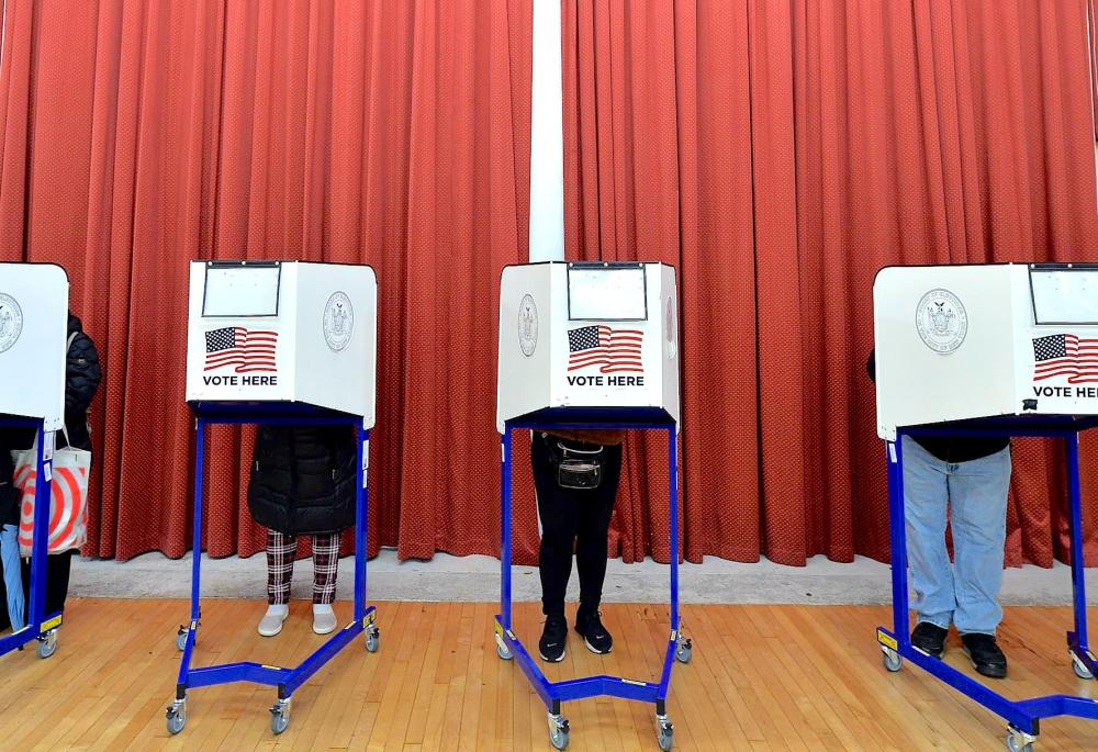 voters behind booths